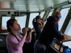 Tereza, Harold and Laura on the bridge, scanning the environment for polar bears (Photo: Jacob Langhinrichs)