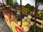 An outdoor vegetable and fruit stand