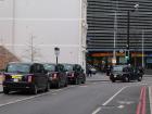 Iconic U.K. black cabs on the street waiting for customers