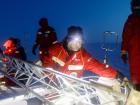 Working to set up a signal tower on the ice