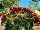 A gateway into a cemetery, showing the importance of marigolds to this holiday