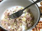 Preparing the filling for "pizza" pastel- oregano, mozzarella, and turkey