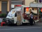 A vendor selling pancakes from a cat-themed truck!