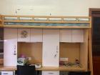 I sleep in a bunkbed above my desk