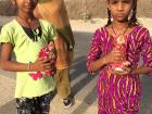 Girls in the village taking their statues for immersion