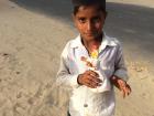 A village boy with a clay Kaniramji