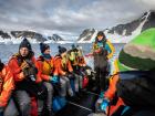 The Inspiring Explorers team on a zodiac ready for a kayaking adventure