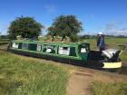 Tom: Here's a picture of our English Narrow Boat with my wife, Gayle