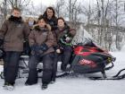 This is a snowmobile and Marco is sitting in the middle