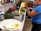 My host aunt is making the masa mixture