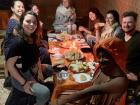 My friends and I having dinner in one of the tents at our campsite