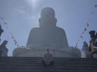 This is me sitting in front of a giant Buddha statue; statues like these can be found across the country!