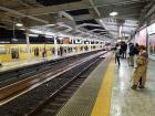 People waiting patiently for an inbound train at Seibu-Shinjuku Station