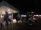 Cowboys showcasing their horses
