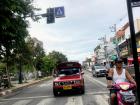 In Chiang Mai, people get around on motorbikes, cars and "songthaews", which are like taxis (see the red one here!) 