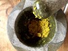 Grinding the spices for green curry
