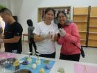 My friends showing off their homemade moon cakes