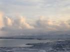 Landing at the Iceland airport, surrounded by icy mountains and freezing ocean