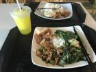 Fried vegetables, chicken, pork and a side of rice with apple-lime juice