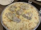 This is the national dish of Jordan, "Mansaf" (lamb in yogurt sauce with rice) and is very popular on "Eid"