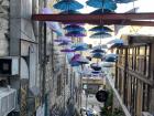 A famous staircase in downtown Amman known for the colorful umbrellas and plants!