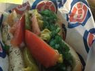 Chicago is known for its great food such as a famous hot dog with sport peppers, celery salt, tomatoes, onions, and mustard!