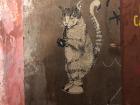 A poster style of graffiti that gets pasted on the wall, instead of painted