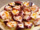 Delicious "Pulpo", always eaten on a wooden plate to absorb the water but leave the oil 