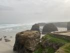 Soft white beaches in contrast with rough water and cliffs 