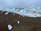 Walking down by the beach to see the waves crashing up on top of the chunks of sea ice that drifted in from the sea ice shelf that covers most of the Arctic Ocean