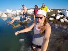 The team completing a "polar plunge" into the freezing cold water!