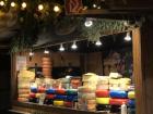 Market booth selling different kinds of cheeses