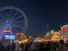 The ferris wheel looming over the crowd