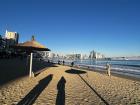 People taking pictures on the beach