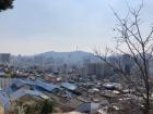 I had to stop to take a picture of the Seoul skyline on our way see the murals 