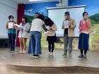 The Principal and a teacher bowing to each other