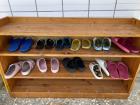 Students take off their street shoes and wear slippers during class