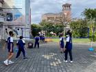 The students playing volleyball