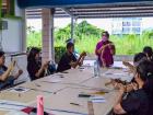 Hana's mom leading a class on weaving