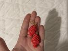 The earrings that I bought myself. They are shaped like acorns, which can be found on the tops of a lot of buildings here