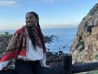 Here is a picture of me at a viewpoint in Morocco; this viewpoint is at the top of the cliff - if you look in one direction, you can see the ocean, if you look in the other direction, you can see the city