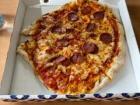 An oddly shaped (but delicious!) Italian pizza