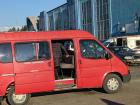 A passenger climbs aboard a marshrutka