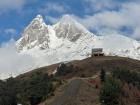 Mount Ushba towers above a hiking trail in Svaneti