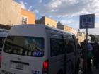 People at the most popular bus stop in Tlaxcala waiting to get on the combi