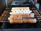 Fresh trdelníks cooking over hot coals (Credit: MOs810 / CC BY-SA 4.0)