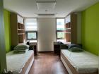 Here is where we live during the year. Rooms at colleges are called dorms and these particular dorms are bright green because it is our school colors.