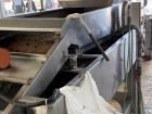 A big machine crushes the olives in Irbid