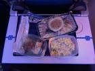 On long international flights, crew members often serve meals