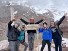 At Chimborazo's base camp with our guide, who is wearing a traditional mask